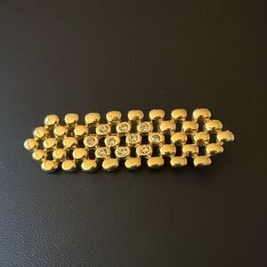 Gold Tone Panther Link Bar Brooch with Clear Rhinestones.